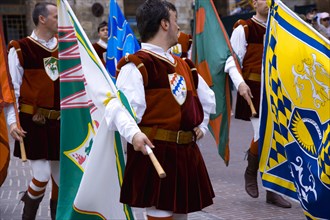 ITALY, Tuscany San, Gimignano, Procession of flag throwers in medieval costume through the streets