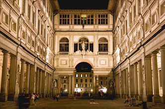 ITALY, Tuscany, Florence, The 16th century Vasari corridor of the Uffizi illuminated at night.