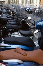 ITALY, Tuscany, Florence, Moped scooters parked in side street.
