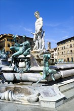 ITALY, Tuscany, Florence, The 1575 Mannerist Neptune fountain with the Roman sea God surrounded by