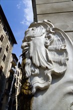 ITALY, Tuscany, Florence, Santa Croce District Drinking water fountain in the form of a male head