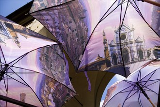 ITALY, Tuscany, Florence, Souvenir stall on the Ponte Vecchio Bridge selling umbrellas with scenes