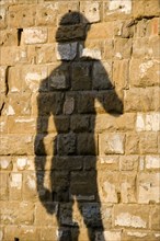 ITALY, Tuscany, Florence, Shadow of the replica Rennaisance statue of David by Michelangelo on the