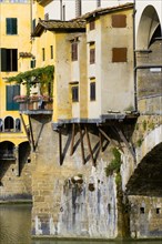 ITALY Tuscany Florence Ponte Vecchio medieval bridge across River Arno. View of merchant's shops