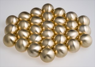 Industry, Machinery, Components, Brass metal lathe turned ball bearings arranged in a hexagon shape