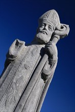 IRELAND, County Mayo, Downpatrick Head, Statue of St Patrick, who prayed frequently in the church.