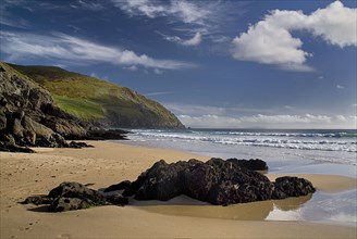 IRELAND, County Kerry, Dingle Peninsula, Coumeenole Beach at Slea Head  Incoming waves with rocks
