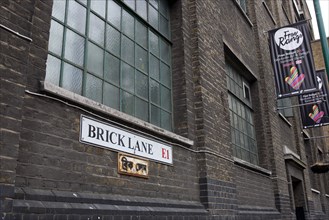 ENGLAND, London, East End, Whitechapel,  Brick Lane, Truman Black Eagle brewery brick wall with its