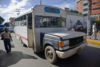 VENEZUELA, Margarita Island, Porlamar, Local route bus, old and in bad state, shoot at the streets