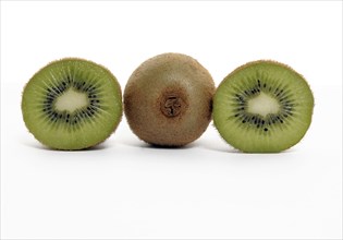 FOOD, Fruit, Kiwifruit, Whole and section through kiwi showing seeds and flesh.