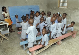 HAITI, Isla de la Laganave, school children in class with teacher.