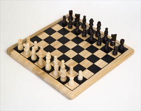 Toys, Games, Board Games, Chess board with pieces laid out for start of game against a white