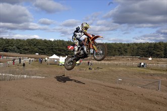 Sport, Bikes, Motocross, Biker in mid jump.