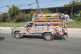 Haiti, Isla de Laganave, Colourfully decorated pick up truck converted into local bus.