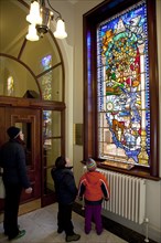 Ireland, North, Belfast, City Hall, Interior,Tourists viewing Centenary Stained Glass Window with