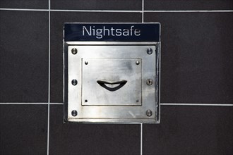Ireland, North, Belfast, Andersonstown, Detail of Nightsafe drawer on on wall of Northern Bank.