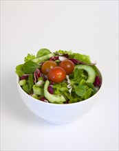 Food, Vegetables, Salad, White bowl of green leaf salad with tomatoes and cucumber on a white