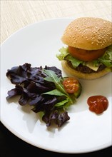 Food, Cooked, Hamburger, Single quarter pound cheeseburger with tomato and lettuce in a bun on a