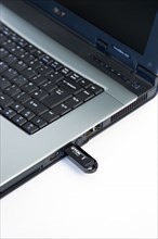 Industry, Computers, Components, 8 gigabyte USB portable flash storage device inserted into laptop