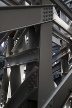 Japan, Tokyo, Kanda, under the JR train tracks, close up of the steel I beams and structure
