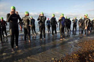 England, West Sussex, Goring-by-Sea, Worthing Triathlon 2009, male competitors at the swim start.