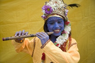 England, London, Hindu Festival, Child dressed as Lord Krishna.
