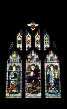 England, West Sussex, East Grinstead, Details of the stained glass windows in Church of St Swithun.