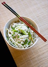 Food, Cooked, Rice, Fried rice with vegetables in a bowl with chopsticks sitting on a bamboo table