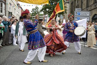 Wales, Denbighshire, Llangollen International Music Festival,Indian performers during parad through
