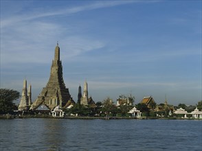 Thailand, Bangkok, view across the Chao Praya river toward Wat Arun temple of the Dawn.