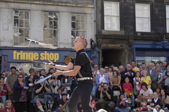 Scotland, Lothian, Edinburgh Fringe Festival of the Arts 2010, Street performers and crowds on the