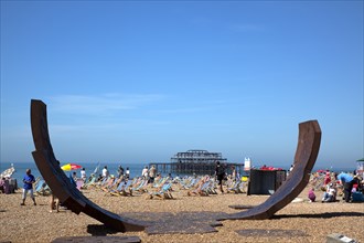 England, East Sussex, Brighton, Modern sculpture installation with the burnt out ruins of the West