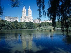 New York City, New York, USA. Central Park. View over The Lake toward city architecture on the