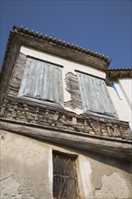 Samos Island, Northern Aegean, Greece. Vathy. Detail of old house with wooden window shutters and