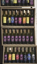Kusadasi, Aydin Province, Turkey. Sirince fruit wines produced locally displayed in wooden crates