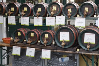 Vienna, Austria. The Naschmarkt. Display of barrels of wine for sale from the cask. Austria