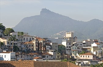 Rio de Janeiro, Brazil. Rooftops of Saude neighbourhood with a hillside favela or slum and the