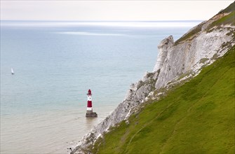 Eastbourne, East Sussex, England. Beachy Head view of the lighthouse at the base of the chalk