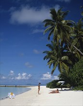 Beach, Maldives. Beach with tourists sunbathing next to the Indian Ocean. Maldives Island Islands