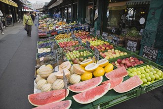 Vienna, Austria. The Naschmarkt. Display of fresh fruit for sale on stall outside shopfront