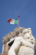 Venice, Veneto, Italy. Centro Storico Arsenale. Part view of crenellated tower flying Italian