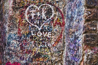 Verona, Veneto, Italy. Casa di Giulietta or Juliets House Graffiti and messages of love on wall at