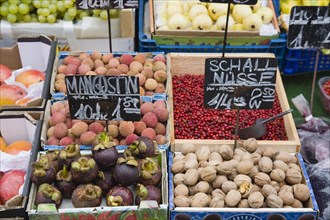 Vienna, Austria. The Naschmarkt. Display of fresh fruit and nuts for sale on market stall including