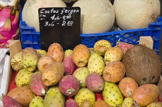 Vienna, Austria. The Naschmarkt. Melon prickly pears and coconut for sale in display on market