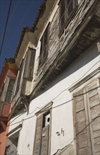 Kusadasi, Aydin Province, Turkey. Exterior facades of Ottoman era whitewashed plaster and wooden