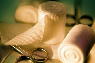 Still life of Hemostat and gauze bandage. Accuracy Accurate Bandage Bandages Clean Cleanliness