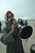 Music, Bahrain. Man playing traditional horn instrument. Bahraini Classic Classical Historical Male