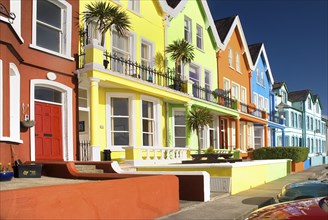 Whitehead, County Antrim, Ireland. Colourfully painted terraced houses with balconies. Ireland