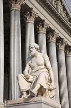 Vienna, Austria. Statue of the Greek philosopher Thucydides in front of the columns to the