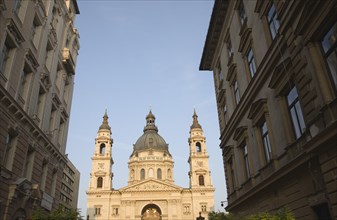 Budapest, Hungary. View along street towards Saint Stephens Basilica exterior facade twin bell